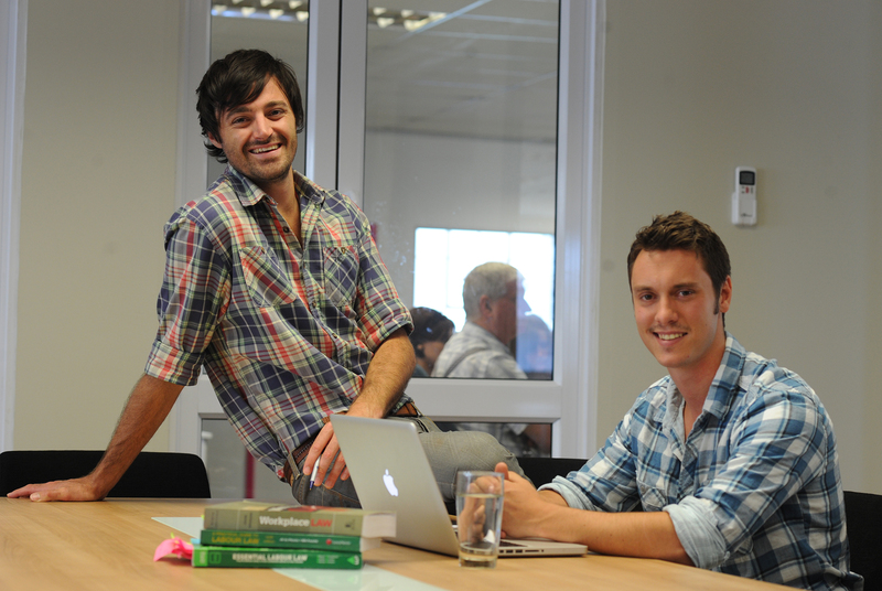 Check those shirts: (from left) Max Cromarty (sales and marketing executive) and Richard Burge (project manager) took time out to crack a smile at the UCT Law@Work Club's offices.