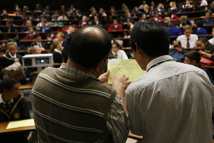 Two maths teachers, part of a 250-strong cohort who helped moderate the 2015 UCT Mathematics Competition, ponder one of the brain teasers.