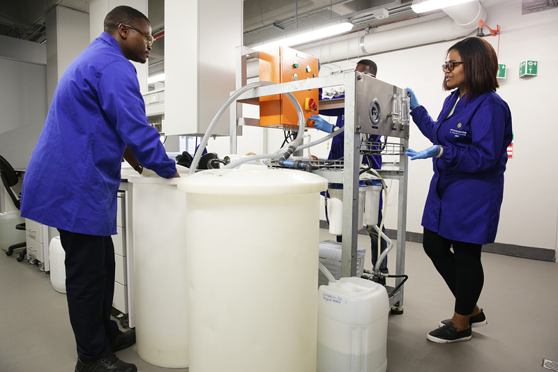 Chemical engineering students work with the reverse osmosis plant to desalinate seawater.