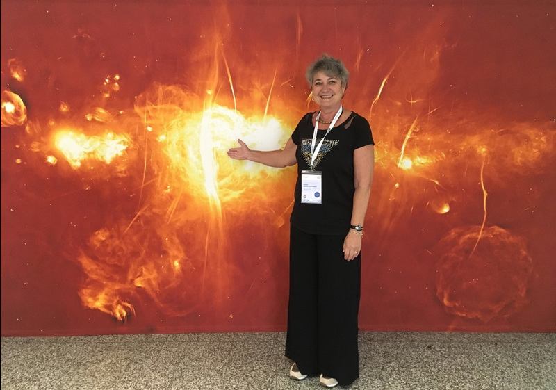 UCT Chair of Astronomy Prof Renee Kraan-Korteweg photographed in Vienna at the General Assembly of the International Astronomical Union the day after the SAWISA event. The MeerKAT image behind her was released at the MeerKAT launch, and featured at the MeerKAT exhibition booth in Vienna.