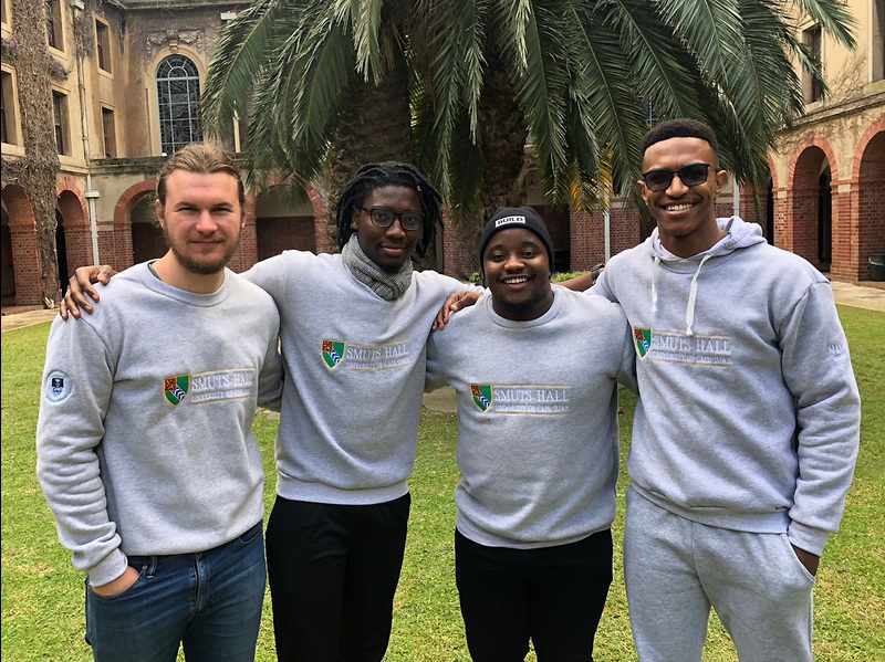 Smuts Hall sub-wardens (from left) Jorich Loubser, Choongo Chibawe, Tafadzwa Ndlovu and Jayson George model the tops available to commemorate the residence’s 90th anniversary.