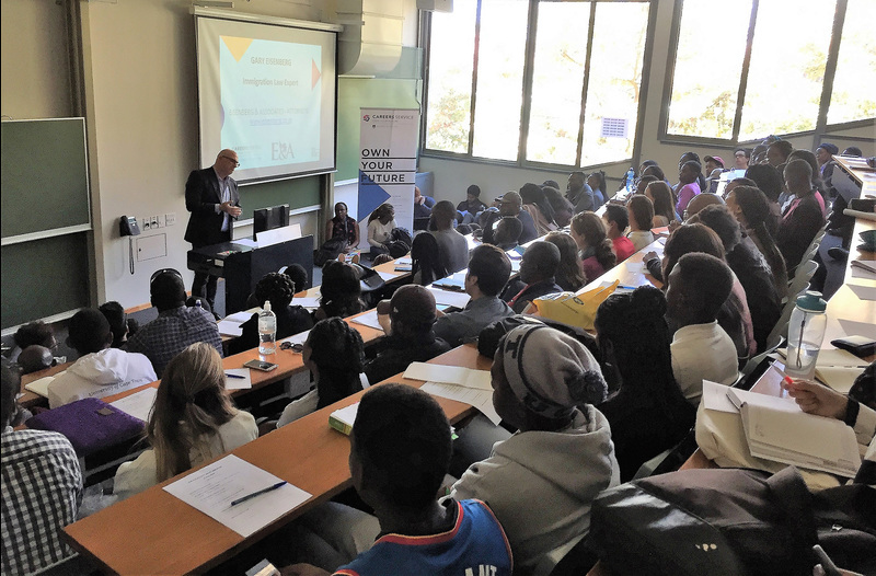 Students packed the lecture hall to hear immigration lawyer Gary Eisenberg discuss the new directive in respect of permanent residence for international applicants.