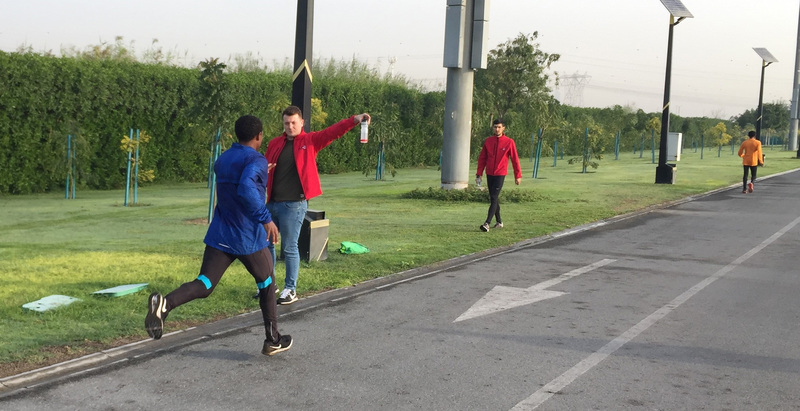 Shaun Sutehall preparing Kenenisa Bekele with the Maurten carbohydrate beverage days before the 2017 Dubai marathon.