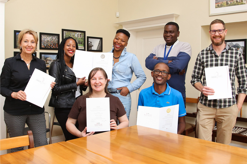 Some of the CMD team members celebrate the awards. They are (back from left) Helen Swingler, Siyavuya Makubalo, Khanyisa Lubambo, Brighton Khoza, Pete van der Woude, and (front from left) Sherry Solman and Thami Nkwanyane.