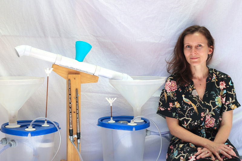 Dr Cara Stacey with her recreated rendition of medieval Islamic polymath al-Jazari’s perpetual flute, one of four designs among the 100 detailed in his text.