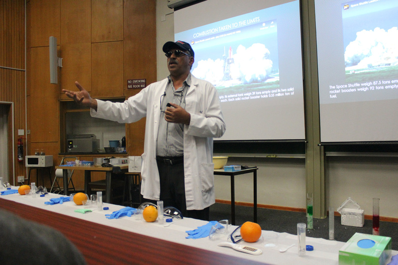 Anwar conducting cool, edible chemistry experiments.