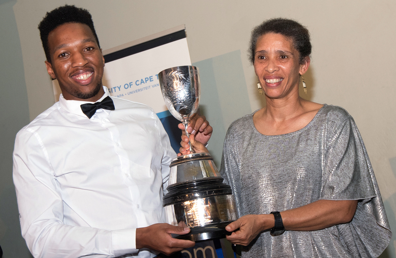 Edwina Brooks (right), director of Student Affairs and herself an avid runner and footballer, presents UCT sprint sensation Mpumelelo Mhlongo with the Jamison Cup.