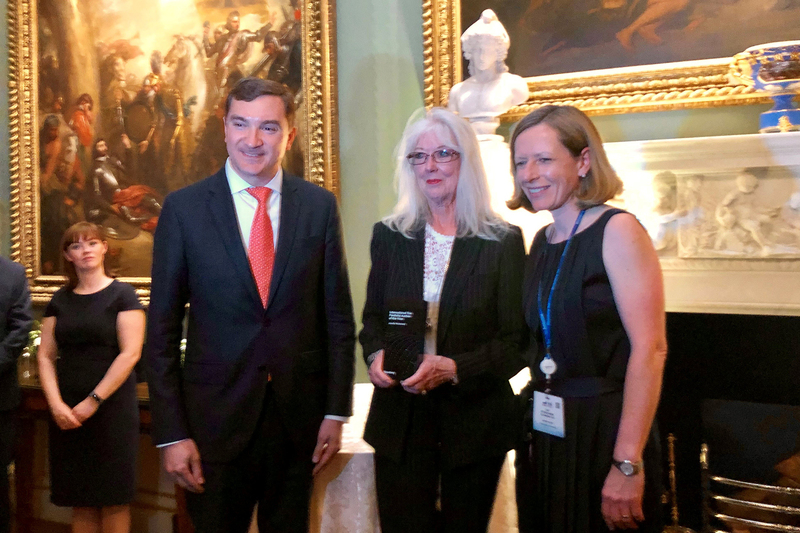 Prof Jennifer Roeleveld (centre) receives her award from Josh Eastright, Bloomberg Industry Group chief executive officer and Lisa Fitzpatrick, president of Bloomberg Tax, at an event in London.