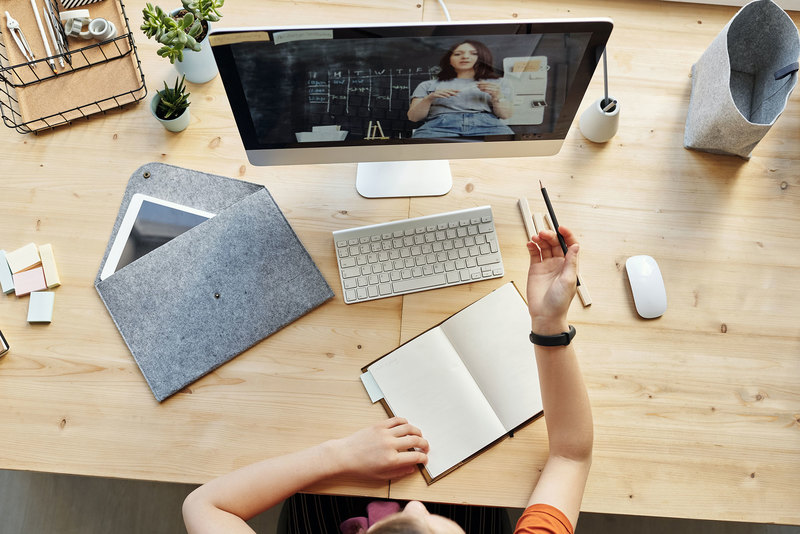 Online tutor helping students through virtual classroom