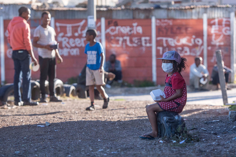 COVID-19’s precipitation of a social and economic crisis has seen the frontline shift into community spaces to address immediate needs, such as this feeding scheme in Lavender Hill. 