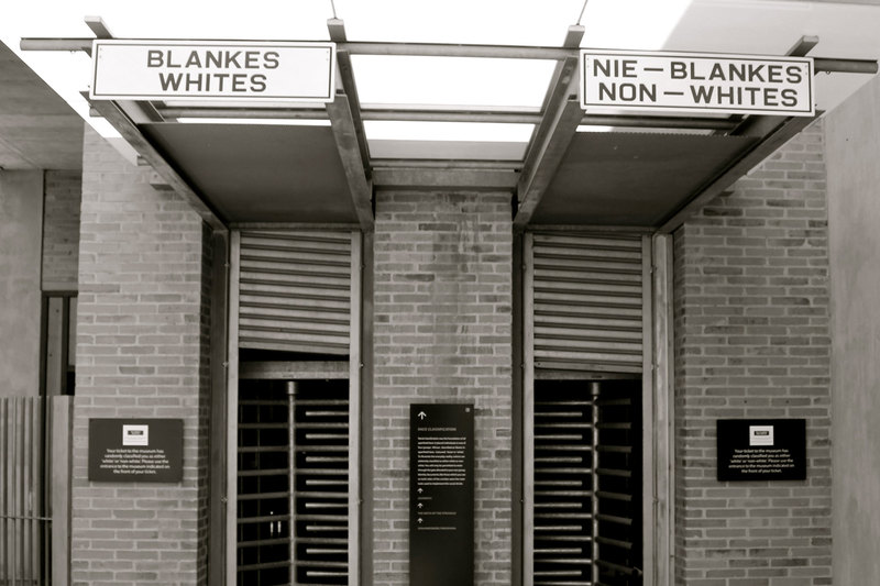 In her address, Dr Robin DiAngelo discussed her experience in South Africa and the contrasting responses to her work by white and black South Africans. <strong>Photo</strong> </em><a href="https://commons.wikimedia.org/wiki/File:Apartheid_Museum_Entrance,_Johannesburg.JPG" target="_blank"><em>Annette Kurylo / Wikimedia Commons</em></a>.