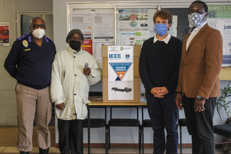 (From left) Owen Ntsasa, the director of the Khayelitsha Metropolitan Police with an elder from the community, Kai Goodall and Dr David Oyedokun at the donation of 2&nbsp;500 multitools to the Khayelitsha community.