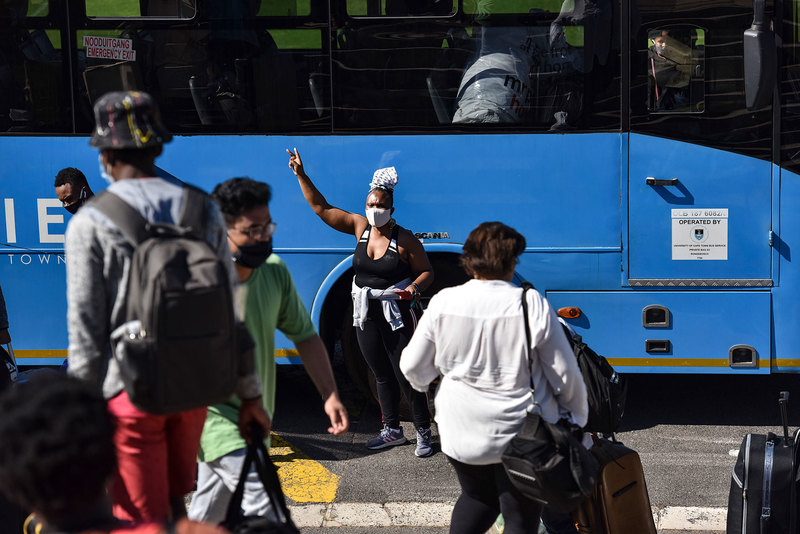 Forty-four students from Smuts Hall and Fuller Hall have been temporarily housed in leased private accommodation, as post-fire restoration processes have delayed their return. In the picture is Fuller Hall acting warden Dr Rethabile Possa-Mogoera directing students who were able to return to UCT buses. <b>Photo</b> Lerato Maduna.