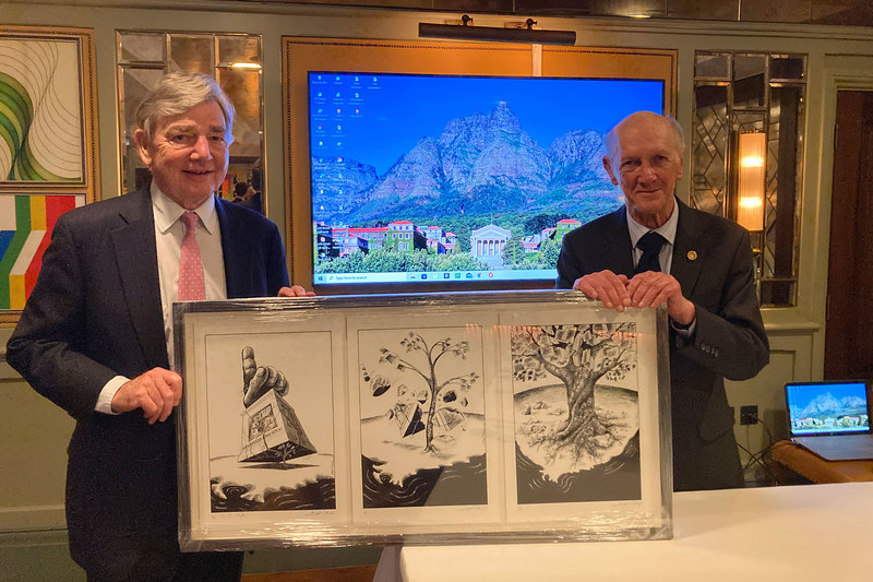 Paul Kumleben (left) presented Sir Frank Berman with an original Zapiro print from 1988 and also announced that the trustees of the UCT Trust, both past and present, have contributed towards LLB scholarships in tribute to Sir Frank’s work with the trust. These scholarships will cover the fees of three eligible students throughout their LLB studies from 2022.  