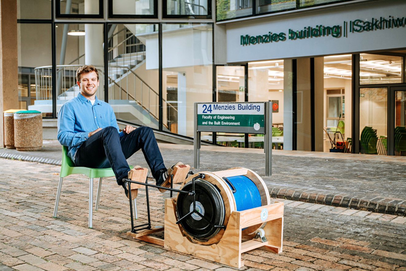 Master’s student Kai Goodall puts his international award-winning, foot-cranked Pedal n Spin washing machine to work.