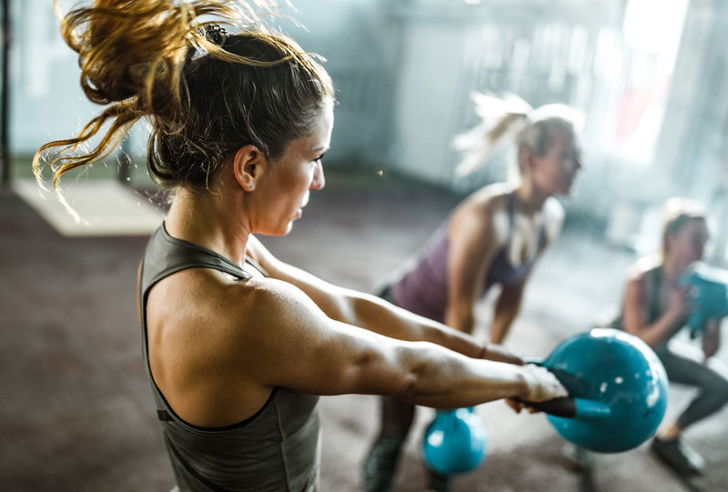 Two female biokineticists at SSISA have created the EmpowHER programme to help women build confidence in the gym and take control of their health. <b>Photo </b><a href="https://www.gettyimages.com/detail/photo/athletic-woman-exercising-with-kettle-bell-on-a-royalty-free-image/1159331475?adppopup=true" target="_blank">Getty Images</a>.
