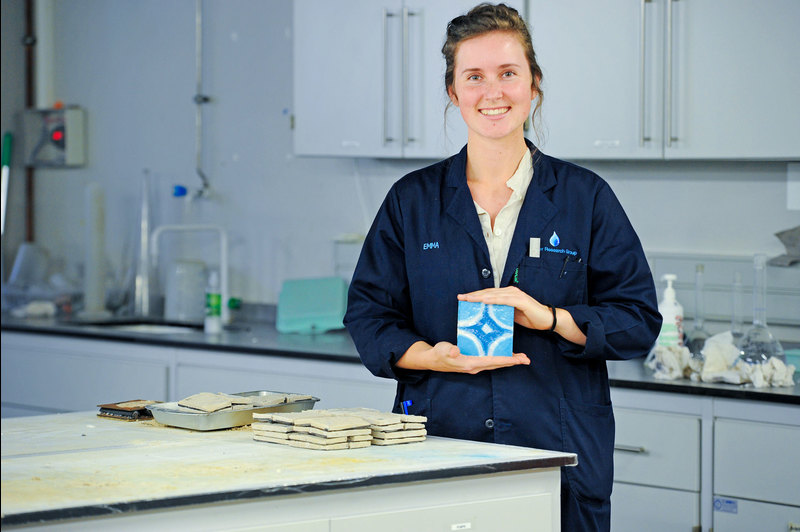 UCT PhD candidate and Falling Walls Lab Cape Town winner Emma Horn in the laboratory with a sample of a tile produced using a biomimetic process inspired by nature. <b>Photo</b> Lerato Maduna.   