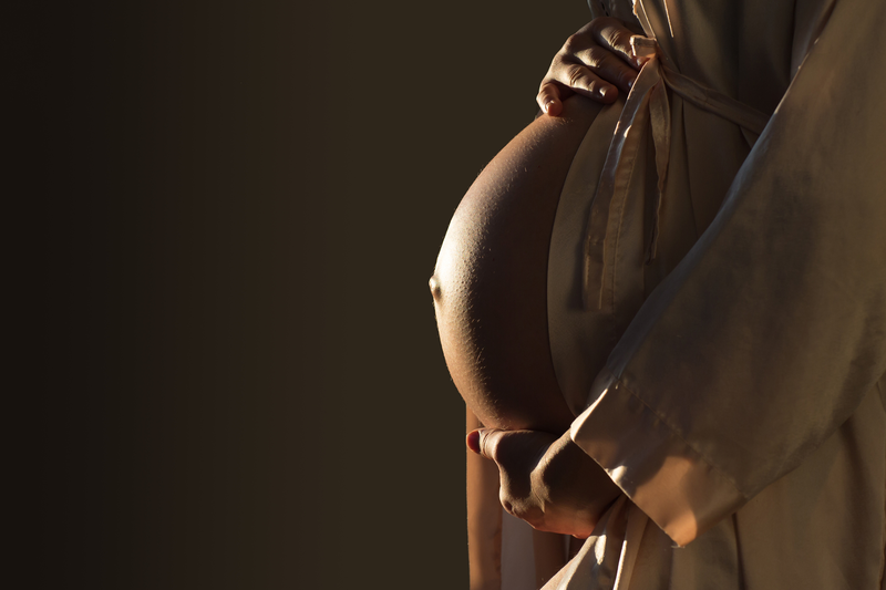 In rural Uganda, pregnant women with physical disabilities face many barriers that negatively impact on their pregnancy experience and pregnancy healthcare. <strong>Photo</strong> <a href="https://www.istockphoto.com/photo/beautifil-silhouette-of-a-pregnant-woman-with-highlight-on-belly-gm938903650-256731676?phrase=pregnant+belly+" target="_blank">iStock</a>.