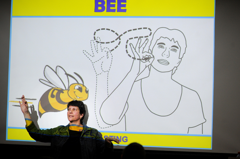 Deaf lecturer June Bothma teaching audiology and speech-language therapy students how to sign different animals and insects by mimicking their physical characteristics and movements. 