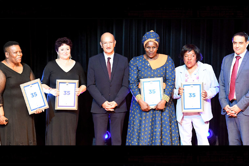 Beverly Ann Bailey, Valencia Betela, Karin Braaf, Arlene Tanya Hanmer and Nomonde Monica Mpangele were given a special honour in recognition of serving UCT for 35 years. With them is Emeritus Professor Reddy and acting chief operating officer, Mughtar Parker.