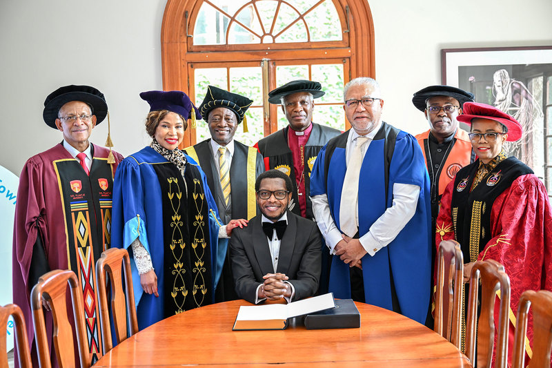 VC Prof Mosa Moshabela (seated) with executive and leaders from some South African universities.