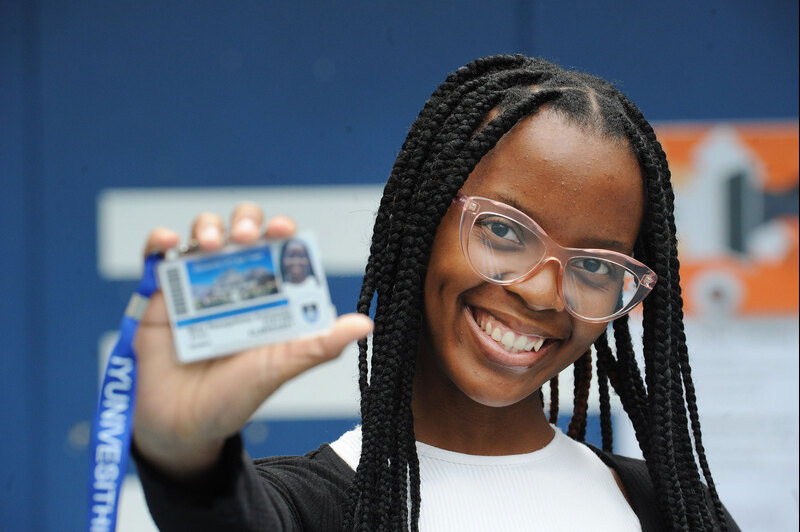 A student shows off her student card during the FYCR. 