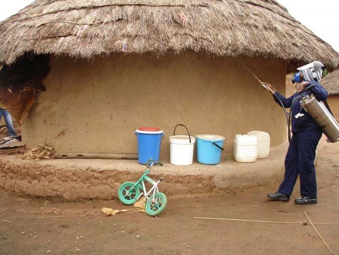 Spraying for mosquitoes in a rural village in the Limpopo province. <b>Photo</b> VHEMBE research group.