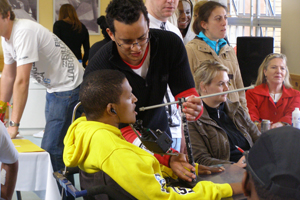 A student helps a patient 