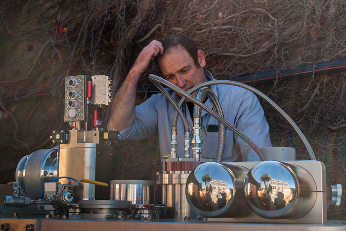 Associate Professor Mark Blumenthal puzzling over various parts of the new dilution fridge.