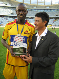 Musa Otieno of Santos, with his coach, Boebie Solomons