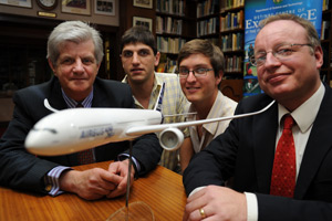 Prof Christiaan Redelinghuys and master's students Nicholas Bizinos and Drewan Sanders, with Airbus' Dale King
