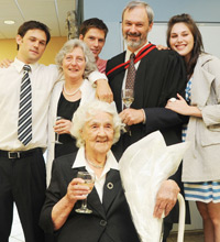 Prof Arthur Argent surrounded by family