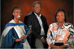 Dr Catherine Kariuki (left) enjoys an award-winning moment with her parents