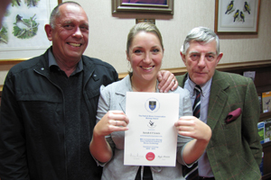 Sarah Lewis congratulated by Prof Phil Hockey and Peter Johnson