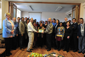 Director Prof Leslie London (right) cuts the cake