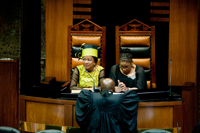 Speaker for the National Assembly Baleka Mbete and chair of the National Council of Provinces Thandi Modise confer with a parliamentary adviser during SONA