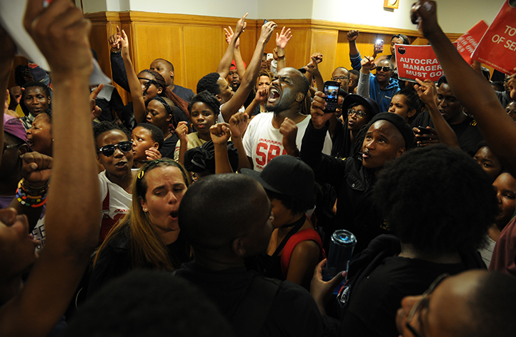 SRC President Ramabina Mahapa leads singing in Bremner&rsquo;s foyer, heralding the beginning of the students&rsquo; occupation. Photo by Michael Hammond.