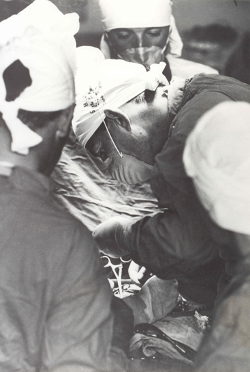 Chris Barnard concentrates as he performs a surgical procedure.