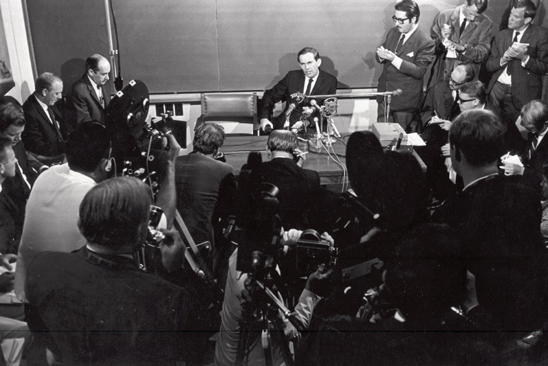 Chris Barnard answers questions in a press conference conducted shortly after the first successful heart transplant.