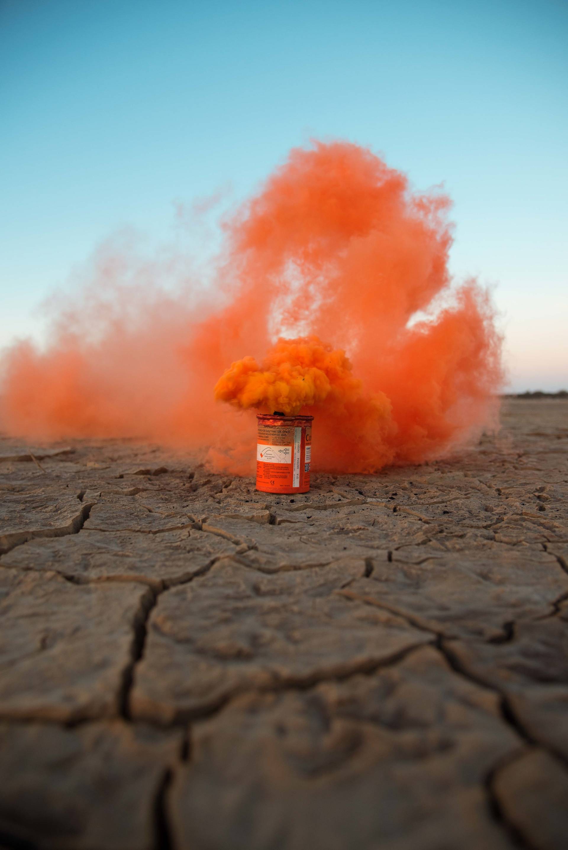 The flare burning in a dried-out dam becomes symbolic of a situation in which a cry for help is already too late.