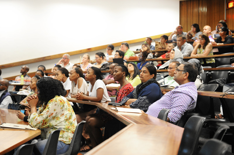 Parents listen intently during a talk by the deans of the faculties.