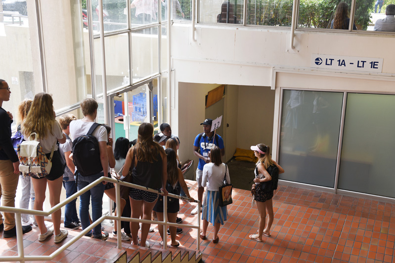 A campus tour group makes a pit stop in the Leslie Social Science building.