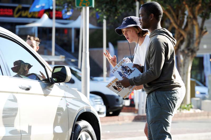 Students took to the streets of Cape Town to sell issues of Sax Appeal magazine on Thursday, 15 February 2018. The 85th edition of Sax Appeal - the annual initiative of UCT RAG (Remember and Give) to raise money for the Student Health and Welfare Centres Organisation (SHAWCO) - focuses on Cape Town's water crisis and depicts life in Cape Town after the arrival of Day Zero. Pictured are students selling to motorists in Claremont.