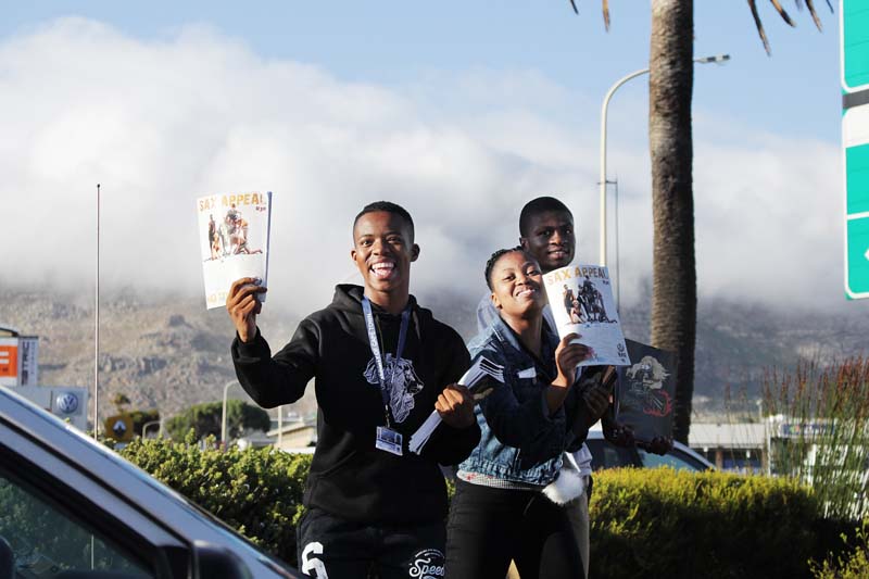 First-year students sell the annual Sax Appeal magazine on the corner of White and Main roads, Tokai.
