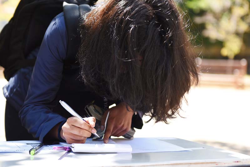 Participants were asked to complete consent forms before having their hair sprayed or cut.