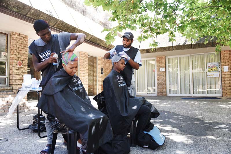 Shavathon volunteers, Andre and Kirshen, were the designated hair sprayers for the day.