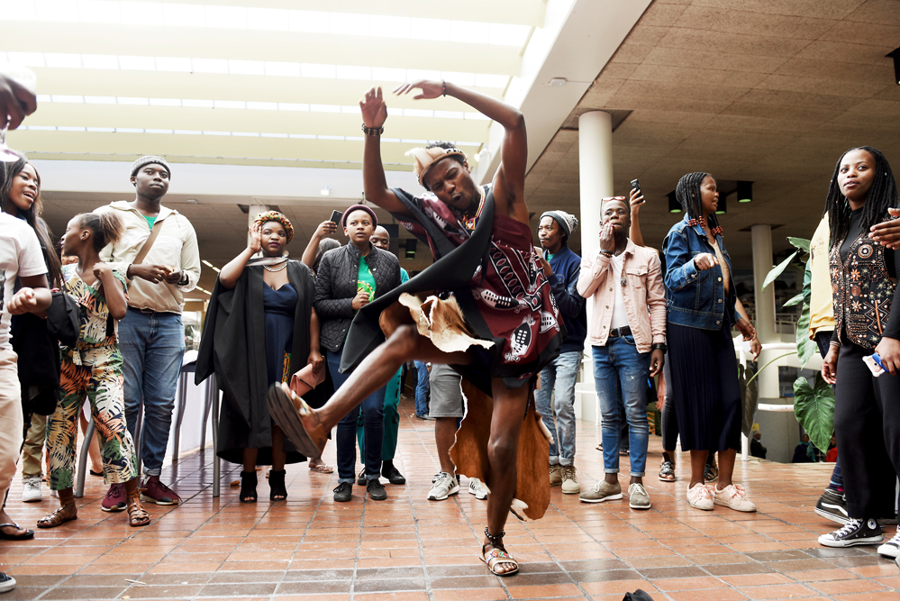 Dancing in celebration at a post-graduation faculty function in the Leslie Social Building.