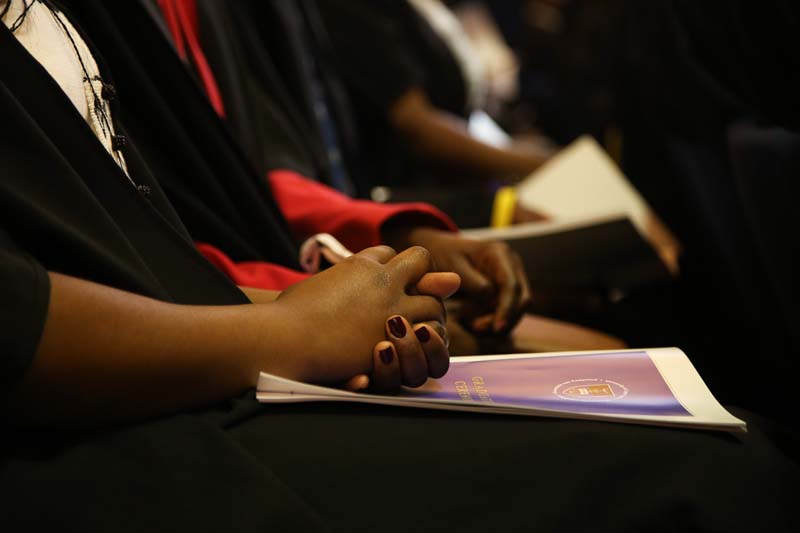 Graduands prepared to go on stage to be capped.