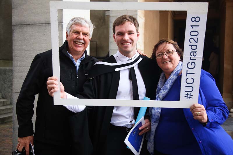 Lloyd Balshaw posed with his proud parents after the ceremony.