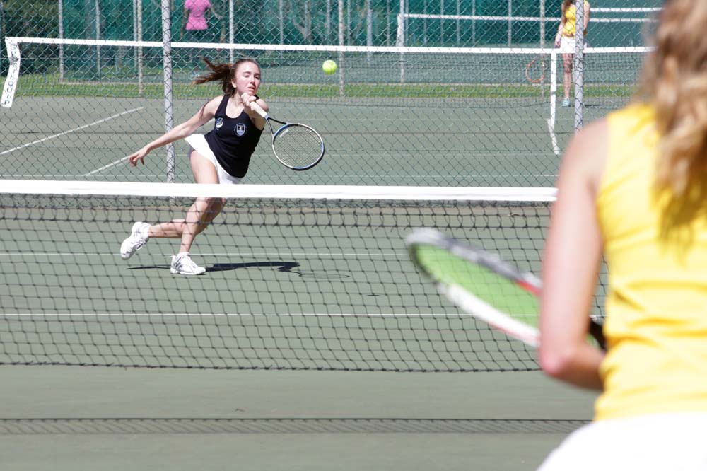UCT’s Gemma Alcock in action on the tennis court against Stellenbosch University opponent Jane Gerber.